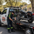 Towing Deltona motorcycle towing service securing a motorcycle on a flatbed tow truck for safe transport