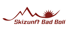 Logo mit roten Bergen, aufgehender Sonne und dem Text "Skizunft Bad Boll" auf weißem Hintergrund.