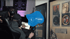 Videoproduktion TN Production - Weltstar Vten und Producer Yaro mit Kopfhörern arbeiten an einem Laptop in Weltraumstudio mit gerahmten Goldplatten von Shakira