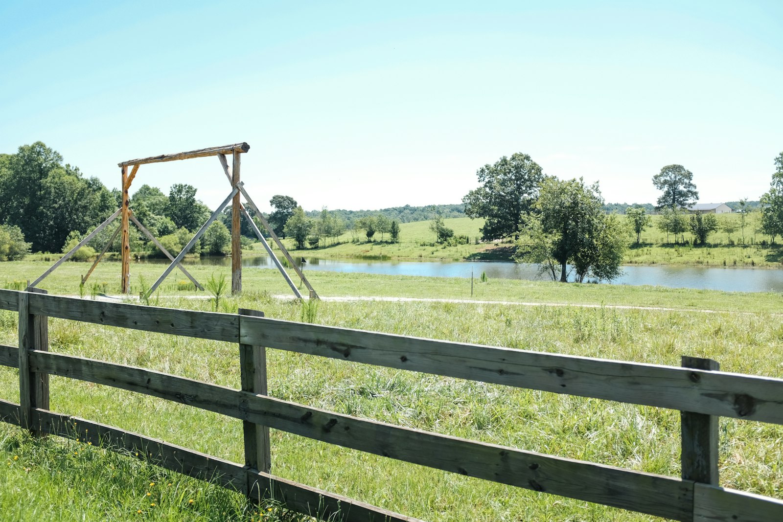 Wooden fence line beside a green yard in Columbia, Maryland