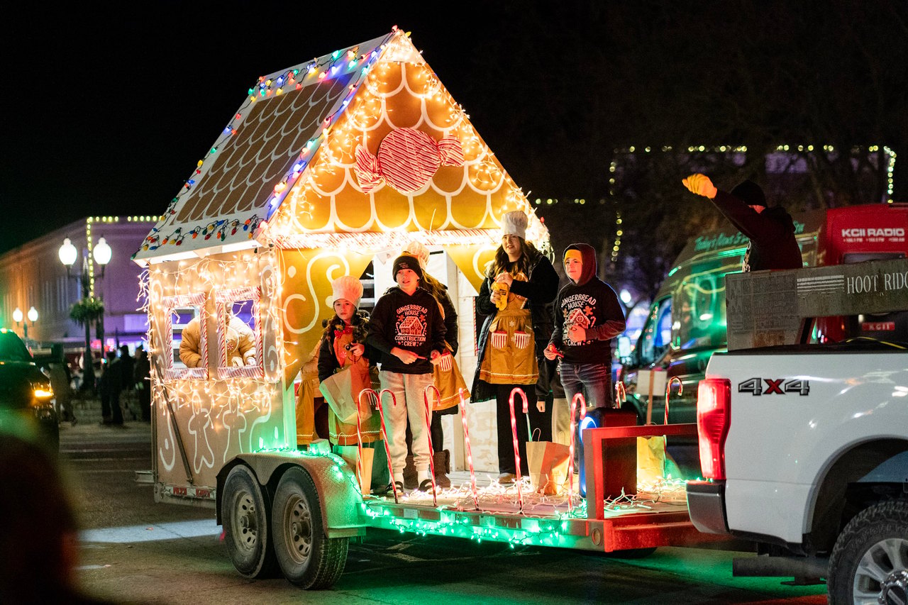 Gingerbread house float in lighted parade