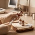 Gloved hands draw medication into a syringe from an Estradiol Valerate vial near Testosterone Cypionate bottles.