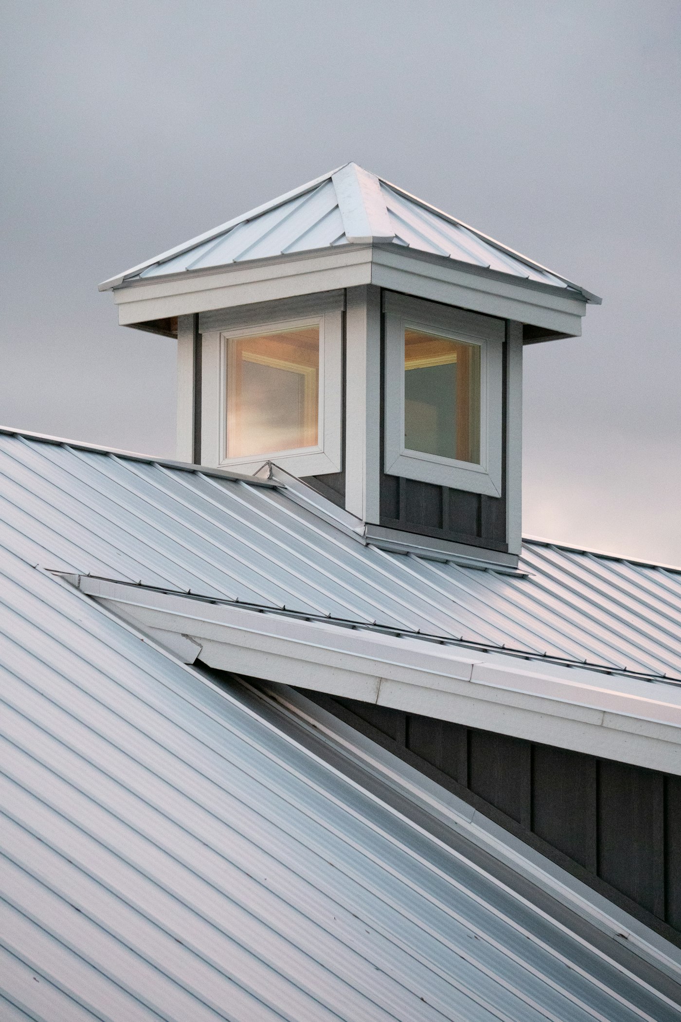 Roof ridge and cupola against a cloudy sky