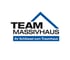 Logo von Team Massivhaus mit blauem Dachsymbol und dem Slogan Ihr Schlüssel zum Traumhaus.