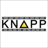 Knapp Logistics Automation Logo: Schwarzer KNAPP Schriftzug mit gelbem Dreieck, umgeben von "LOGISTICS" und "AUTOMATION".