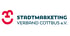Logo des Stadtmarketing Verband Cottbus e.V. mit einem roten, abstrakten Smiley-Symbol links neben dem Schriftzug.