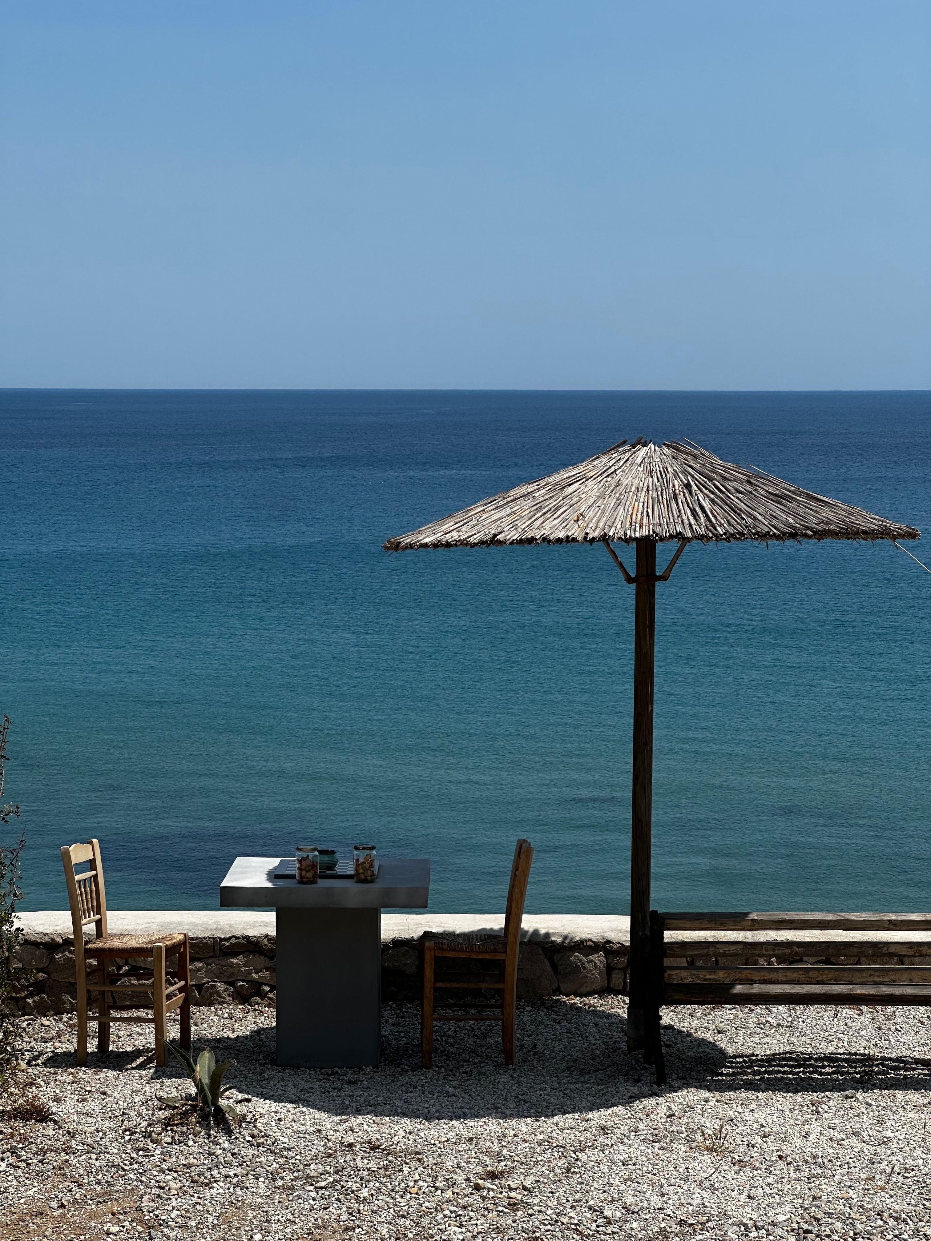 Table and parasol overlooking the sea