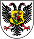 Wappen mit schwarzem Doppeladler, gelbem Schild mit Reiter, der einen Drachen tötet.