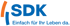 SDK-Logo mit blauem Text „SDK Einfach für Ihr Leben da.“ und orangefarbener, blauer Klammer.