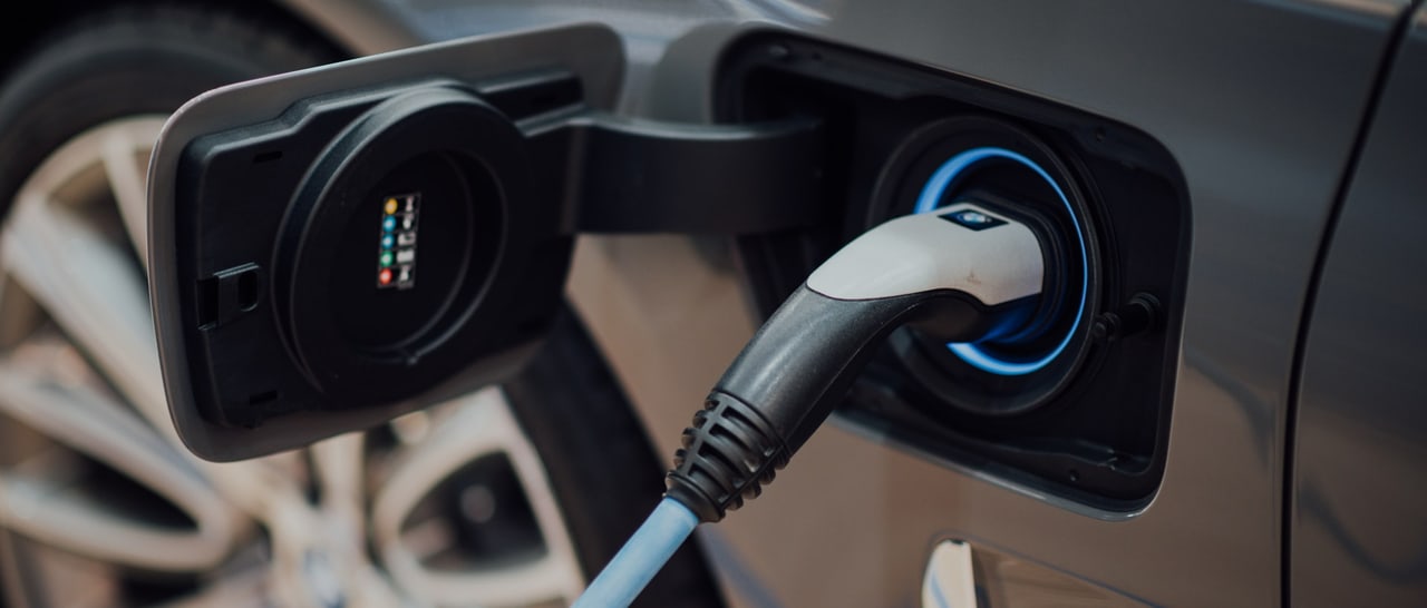 Charging connector plugged into an electric vehicle charge port