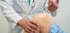 Doctor administering a trigger point injection into patient’s knee