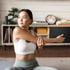 Young woman stretching before trigger point injection therapy
