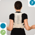 Woman wearing a beige posture corrector brace over a black shirt.