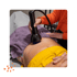 Practitioner applying shockwave therapy on back