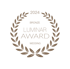 Bronzener Lorbeerkranz auf schwarzem Grund mit dem Text 2024 Bronze Luminar Award Wedding.