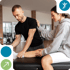 Male therapist assessing female patient's leg for sports injury