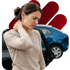 A woman holds her neck in pain next to a car with a damaged rear bumper.