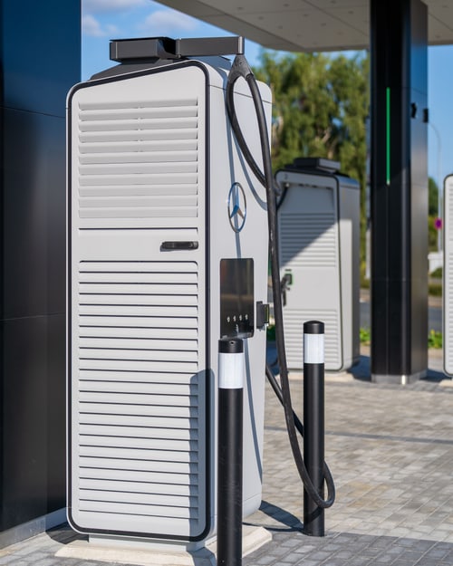Home EV charger charging an EV with solar panels on a San Clemente roof