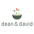 Logo von dean & david mit einer dunkelgrauen Schale und bunten Blättern in Rot, Grün und Gelb.