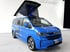 VW Caravelle Campervan mit offenem Aufstelldach von vanexxt