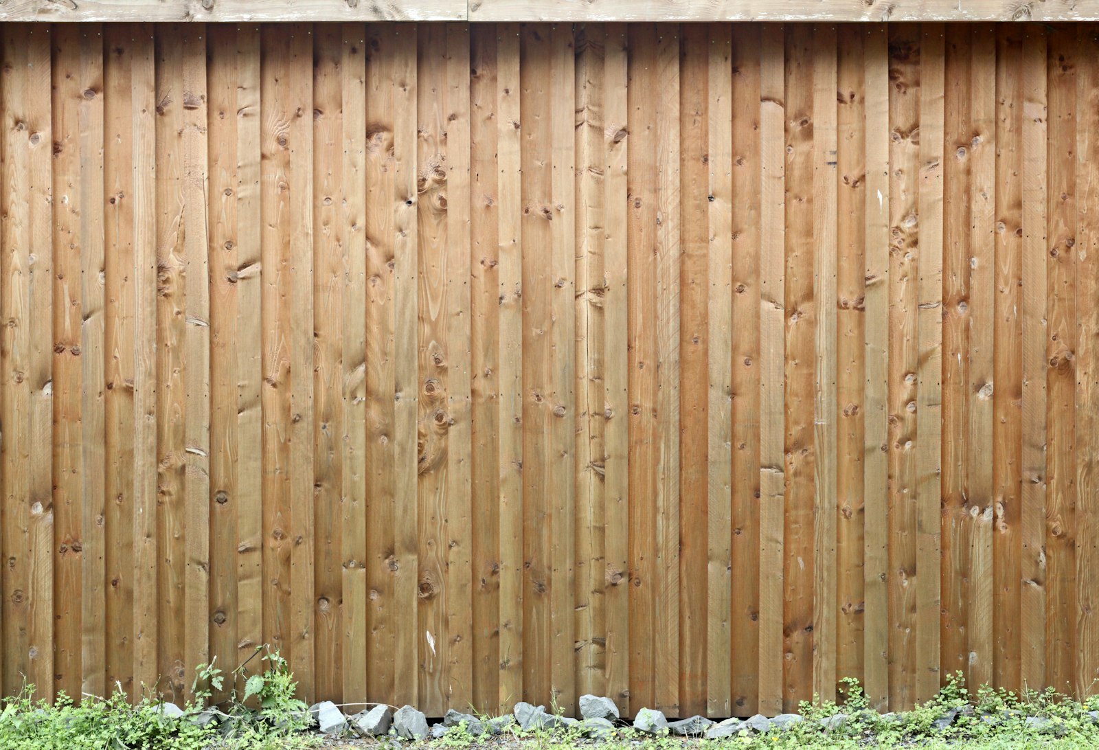 Finished wood fence line running behind a home in Columbia, Maryland