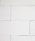 White textured aerated concrete blocks stacked in a staggered wall pattern.