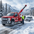 Towing Sandy snow recovery service pulling a vehicle from a snow-covered roadside while assisting stranded motorists in winter conditions.