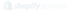 Weißes Shopify-Logo mit Einkaufstasche und Text "shopify partners" auf grünem Hintergrund.