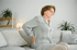 Woman experiencing lower back pain, possible herniated disc discomfort