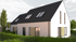 Modern white house with dark gray roof, multiple windows, and a green hedge in front.