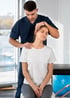 Chiropractor adjusts a patient's neck.