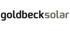 Goldbecksolar Logo in grauer und weißer Schrift auf schwarzem Hintergrund.