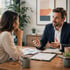 Man in suit discusses documents over desk during Business management meeting