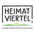 Das Logo „Heimat Viertel!“ in einem Rahmen, mit Hügeln und dem Text „Lallinger Winkel – Ohetal – Sonnenwald“ darunter.