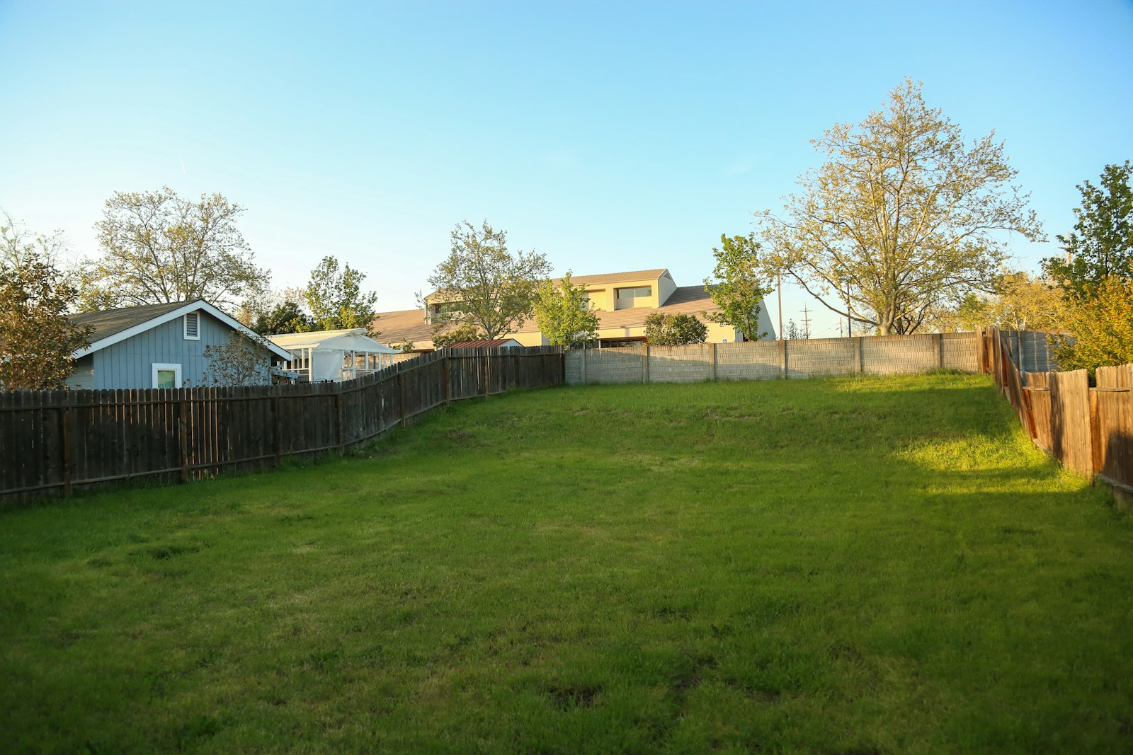 Fenced backyard behind a home in a Columbia, Maryland neighborhood