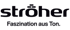 Schwarzes Stroer-Logo mit dem Text "Faszination aus Ton" auf grünem Hintergrund.