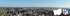 Panorama-Luftaufnahme einer Ortschaft mit Wappen