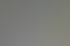 Drei Personen sitzen an einem Tisch; im Hintergrund ist ein Bildschirm mit dem Text "Immobilien Gruppe" zu sehen.