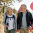 Smiling seniors hike, their stride steady after neuropathy treatment.