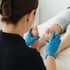 Doctor examining a patient’s feet, providing care for neuropathy treatment.