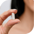 Female patient holding a pill for bioidentical hormone replacement