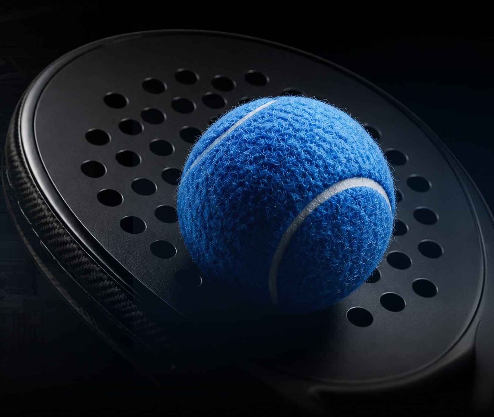 Padel racket with a blue padel ball