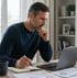 Man focused on laptop and notes supported by rapamycin therapy.