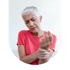 A senior woman in a red shirt winces while holding her wrist and looking down at her hand.