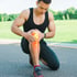 An athlete clutching his knee, seeking knee pain relief.