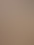 Wand unter der Dachschräge in warmem Terracotta, exakt um das Dachfenster herum gearbeitet.