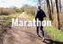 Läufer auf einem Feldweg mit Bäumen und Büschen; Text: Marathon