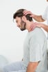 man in need of neck pain relief getting physical therapy