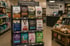 Pet store aisle with a display of various dog and cat food bags, including brands like Royal Canin and Wellness.