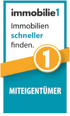 Logo von immobilie1 mit dem Text Immobilien schneller finden und Miteigentümer auf blauem Grund.